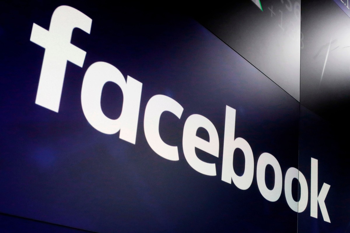 FILE - In this March 29, 2018, file photo, the logo for Facebook appears on screens at the Nasdaq MarketSite in New York's Times Square. Facebook is paying a $4.75 million fine and up to $9.5 mil ...