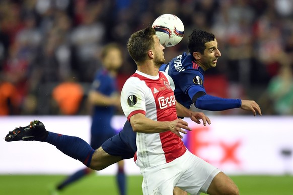 Ajax&#039;s Joel Veltman vies for the ball with United&#039;s Henrikh Mkhitaryan, right, during the soccer Europa League final between Ajax Amsterdam and Manchester United at the Friends Arena in Stoc ...