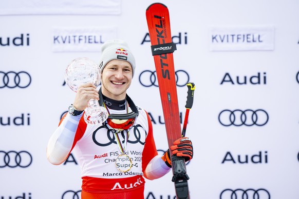 Marco Odermatt of Switzerland, winner of the men's Super-G overall leader crystal globe trophy, celebrates during the podium ceremony at the Lillehammer FIS Alpine Ski World Cup Finals, in Kvitfj ...