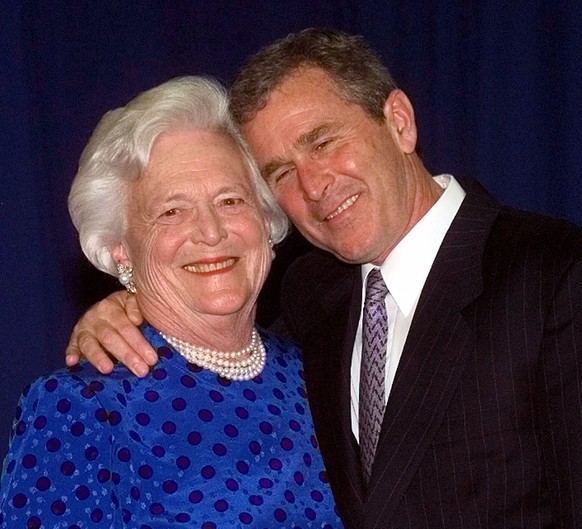 FILE - In this June 10, 1999, file photo, Texas Gov. George W. Bush, right, gives his mother, Barbara Bush, a hug after taking a family photo in Houston. A family spokesman said Tuesday, April 17, 201 ...