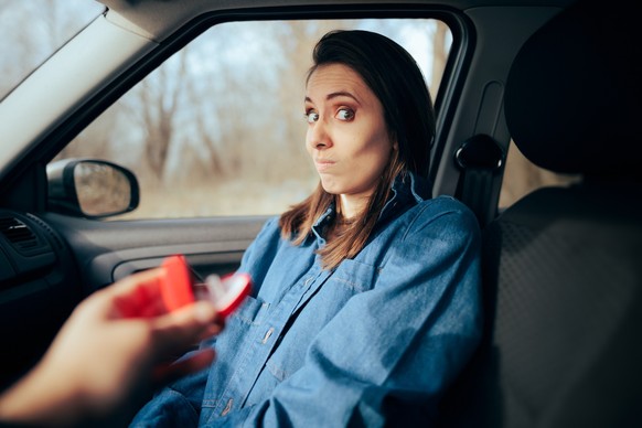 A woman has a surprising reaction to her boyfriend who popped the question in the car