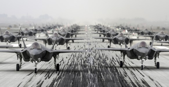In this photo provided by South Korea Defense Ministry via Yonhap News Agency, South Korean Air Force&#039;s F-35A stealth fighters perform an elephant walk at an unidentified air base, South Korea, F ...