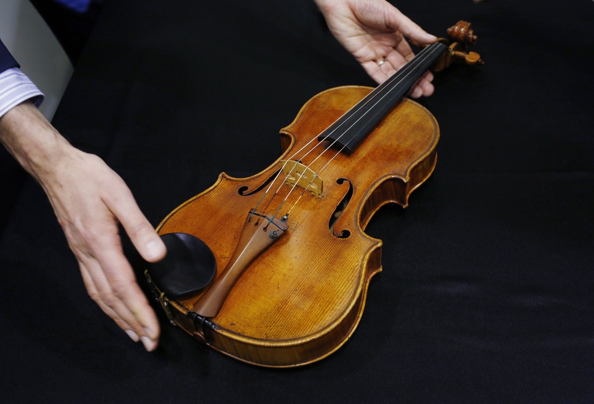 A rare 1719 viola called the "Macdonald" by Antonio Stradivari is displayed during a preview at the Sotheby's auction in Hong Kong Friday, April 4, 2014. A rare 1719 Stradivarius viola  ...