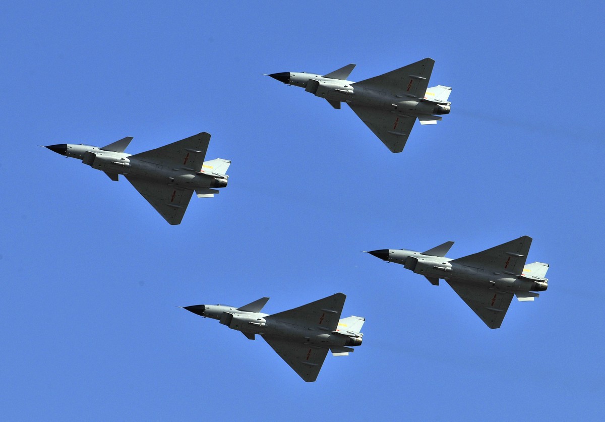 FILE - J-10 jet fighters perform in formation to celebrate the 60th anniversary of the People's Liberation Army Air Force in Beijing, China, Nov. 15, 2009. China sent dozens of warplanes, includi ...