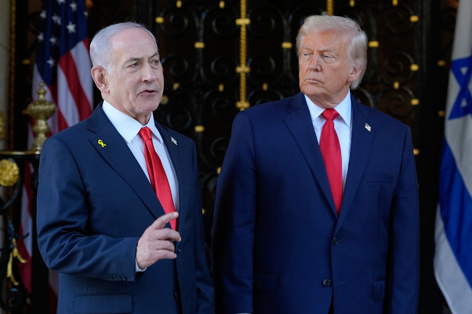 FILE - President Donald Trump listens as Israel's Prime Minister Benjamin Netanyahu speaks at President Donald Trump's Mar-a-Lago club, Dec. 29, 2025, in Palm Beach, Fla. (AP Photo/Alex Bran ...