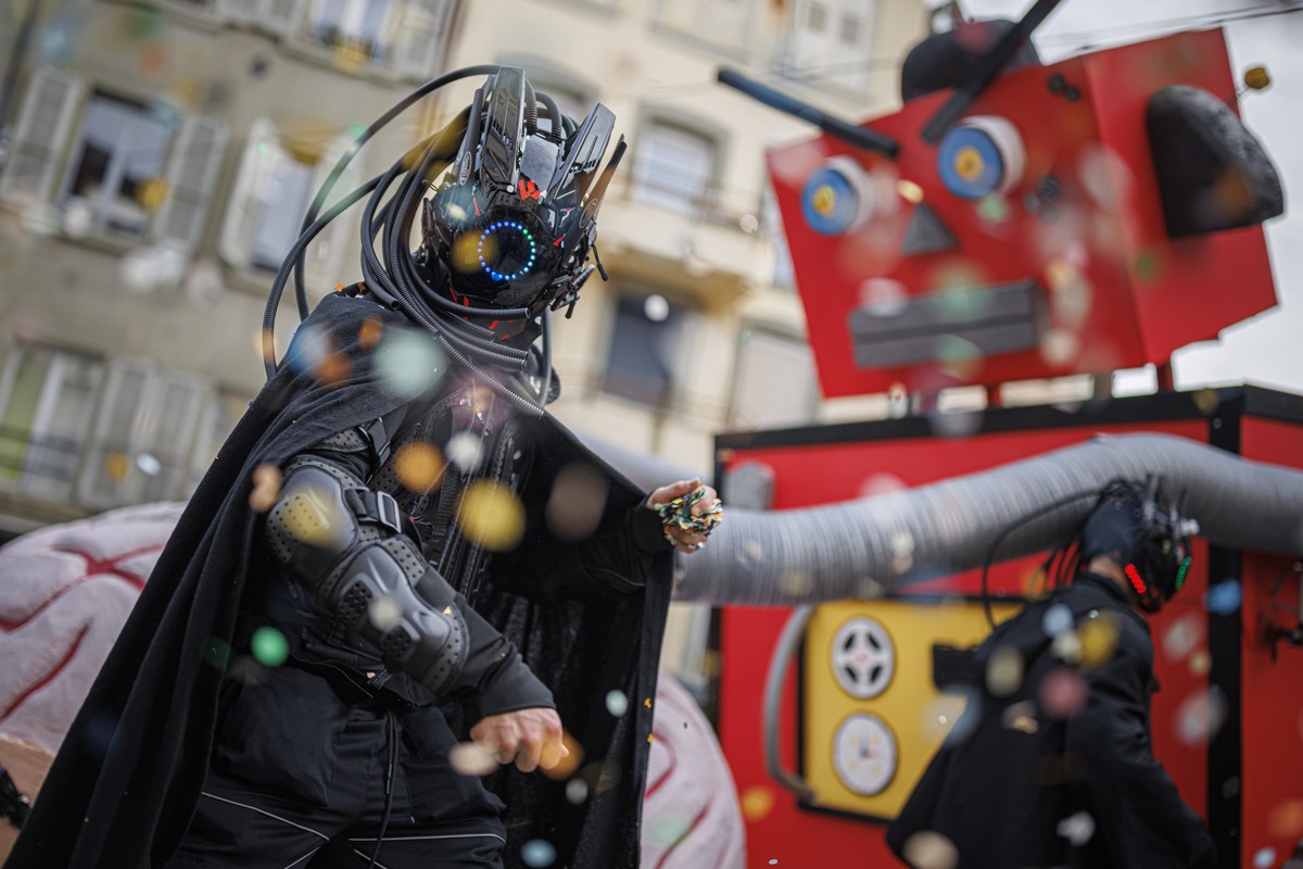 A reveler parades on his artificial intelligence themed float during the 129th edition of the "Brandons de Payerne" carnival parade in Payerne, Switzerland, Sunday, February 18, 2024. (KEYST ...