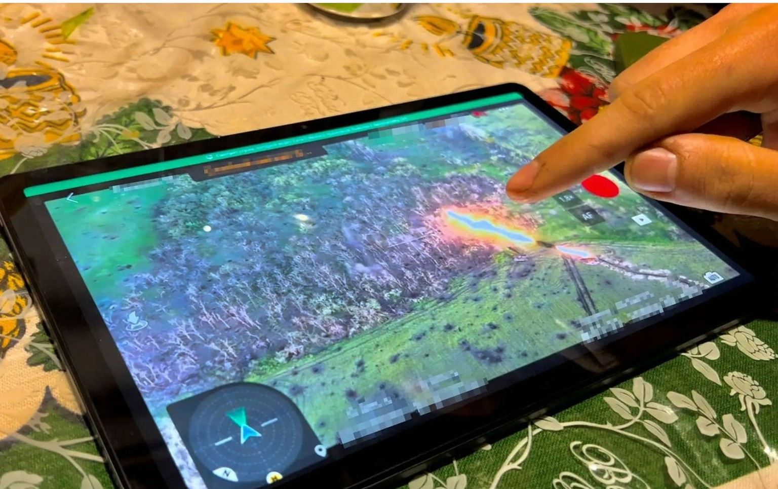 Iwan shows on his tablet how his soldiers' mine snake explodes.