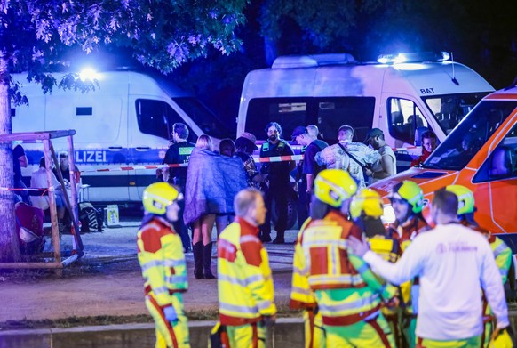 epa13132959 Police and security personnel work near the scene where several people were injured on the sideline of the Christopher Street Day (CSD) parade in Berlin, Germany, 25 July 2026. According t ...