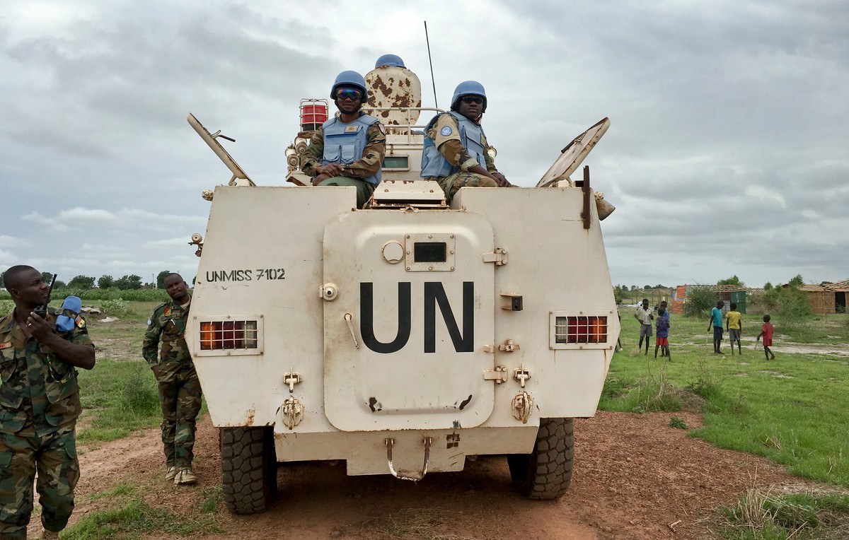 FILE - In this Sunday, June 18, 2017 file photo, peacekeepers from the United Nations Mission in South Sudan (UNMISS) provide security during a visit of UNCHR High Commissioner Filippo Grandi to the U ...