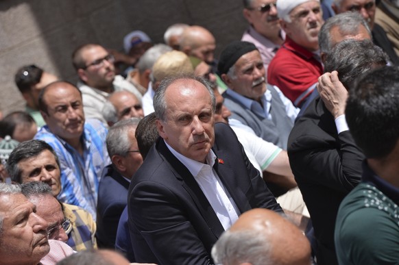 Muharrem Ince, a lawmaker with Turkey&#039;s main opposition Republican People&#039;s Party, CHP, and the party&#039;s presidential candidate, prays with supporters as he begins his campaign in Ankara ...