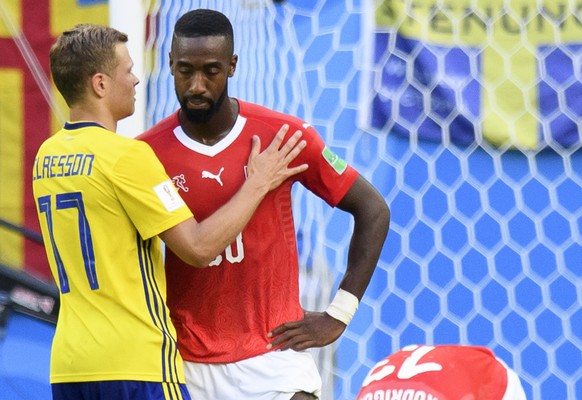 Sweden&#039;s midfielder Viktor Claesson, left, reconforted from left in red Switzerland&#039;s defender Johan Djourou, Switzerland&#039;s defender Ricardo Rodriguez and Switzerland&#039;s defender Ma ...