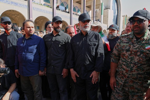 Iran's paramilitary Revolutionary Guard Gen. Ahmad Vahidi, center right, attend a prayer part of the dayslong funeral ceremonies for the slain Iranian Supreme Leader Ayatollah Ali Khamenei and me ...
