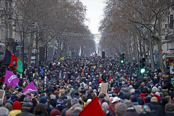 epa10415854 Protesters demonstrate during a national strike against the government's reform of the pension system, in Paris, France, January 19, 2023. The French government plans to increase the minimum ratio ...