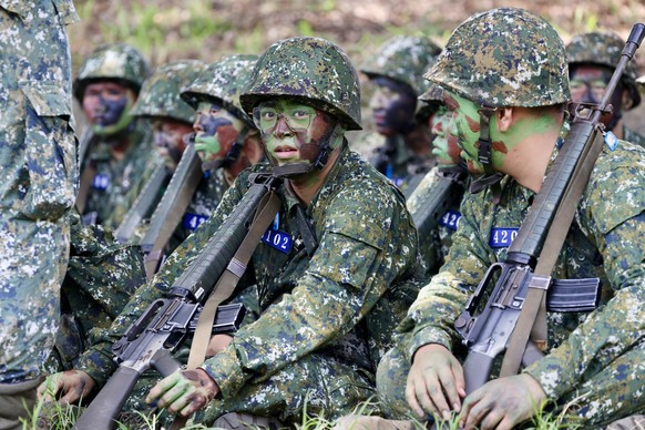 epa11442654 New army recruits hold a training session during a visit by Taiwanese President William Lai (not pictured) at a military camp in Taichung, Taiwan, 28 June 2024. Lai visited the camp to obs ...