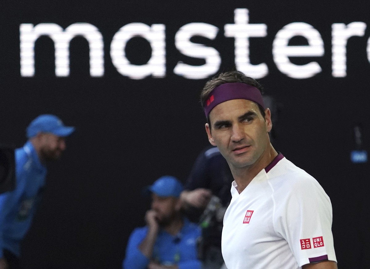 Switzerland's Roger Federer reacts after defeating Tennys Sandgren of the U.S. in their quarterfinal match at the Australian Open tennis championship in Melbourne, Australia, Tuesday, Jan. 28, 20 ...