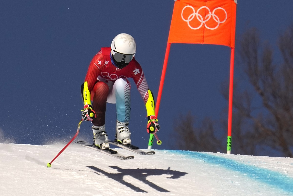 Lara Gut-Behrami, of Switzerland makes a jump during women's downhill training at the 2022 Winter Olympics, Monday, Feb. 14, 2022, in the Yanqing district of Beijing. (AP Photo/Robert F. Bukaty)