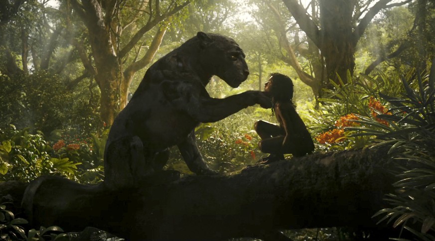 This image released by Netflix shows Rohan Chand as Mowgli, right, and the character Bagheera, voiced by Christian Bale, in a scene from the film, &quot;Mowgli: Legend of the Jungle,&quot; streaming o ...