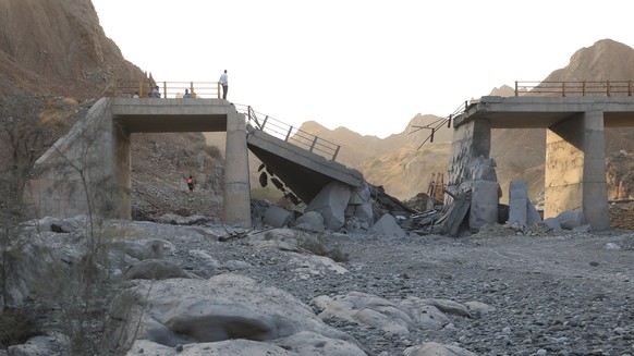 People stand on a bridge destroyed after a strike in Hormozgan province, southern Iran, Saturday, July 18, 2026. (Amirhosein Khorgooi/Iranian Students' News Agency via AP)
Iran War