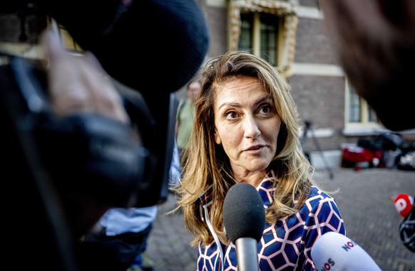 epa10730859 Netherland&#039;s Justice and Security Minister Dilan Yesilgoz-Zegerius speaks to journalists as she arrives at the General Affairs Ministry to continue consultations on the asylum policy, ...