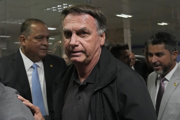Former Brazilian President Jair Bolsonaro arrives for a luncheon with senators from his support base, at the National Congress building in Brasilia, Brazil, Tuesday, Feb. 18, 2025. (AP Photo/Eraldo Pe ...