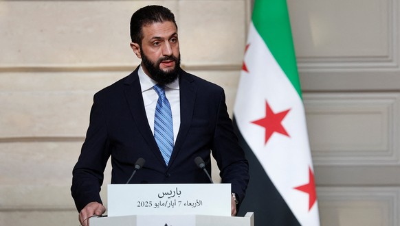 epa12081462 Syrian President Ahmed al-Sharaa speaks during a joint press conference with French President Emmanuel Macron (not pictured) after their meeting at the Elysee Palace in Paris, France, 07 M ...