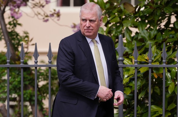 FILE - Britain's Andrew Mountbatten-Windsor, formerly known as Prince Andrew, looks round as he leaves after attending the Easter Matins Service at St. George's Chapel, Windsor Castle, Engla ...