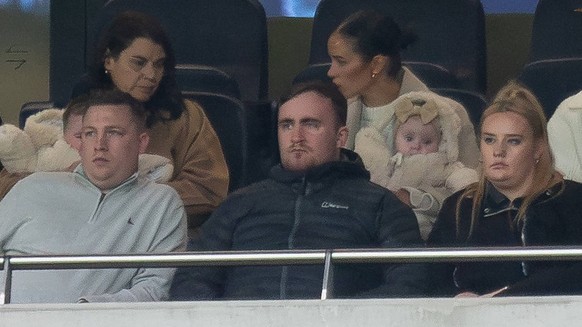 Tottenham Hotspur v Bournemouth Premier League 31/12/2023. Darts players Chris Dobey and Luke Littler 16 watch the game, guests of Tottenham Hotspur midfielder James Maddison 10 white jacket and cap d ...