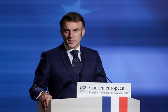 epa12602196 French President Emmanuel Macron speaks to the media at the end of the first day of the EU Council Summit in Brussels, Belgium, 19 December 2025. EU leaders met to discuss the latest devel ...