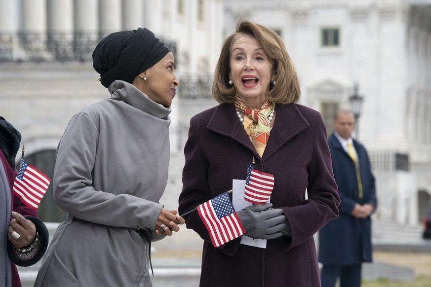 Rep. Ilhan Omar, D-Minn., left, joins Speaker of the House Nancy Pelosi, D-Calif., as Democrats rally outside the Capitol ahead of passage of H.R. 1, &quot;The For the People Act,&quot; a bill which a ...