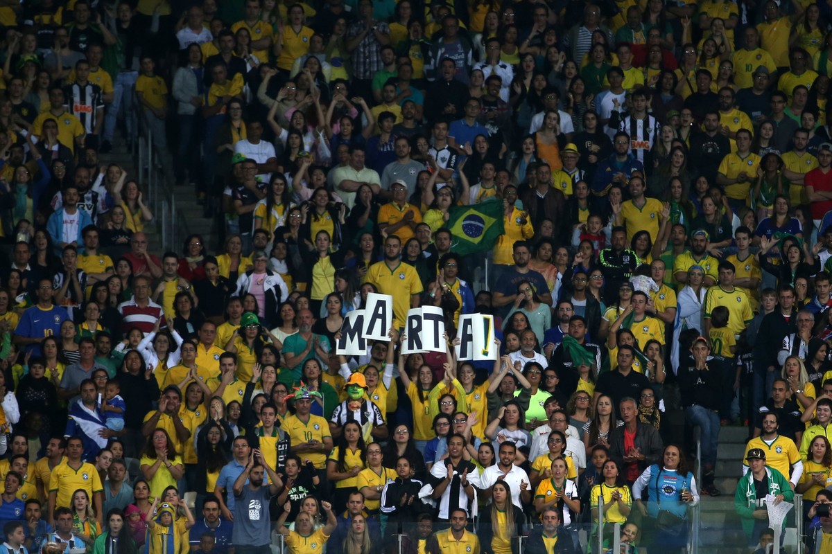 FILE - In this Aug. 12, 2016 file photo, fans cheer for Brazil's Marta during a quarter-final match of the women's Olympic football tournament against Australia at the Mineirao Stadium in Be ...