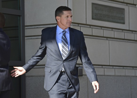 FILE - In this Dec. 1, 2017 file photo, former Trump national security adviser Michael Flynn leaves federal court in Washington. On Feb. 23, 2018, Flynn was the first White House official charged in R ...
