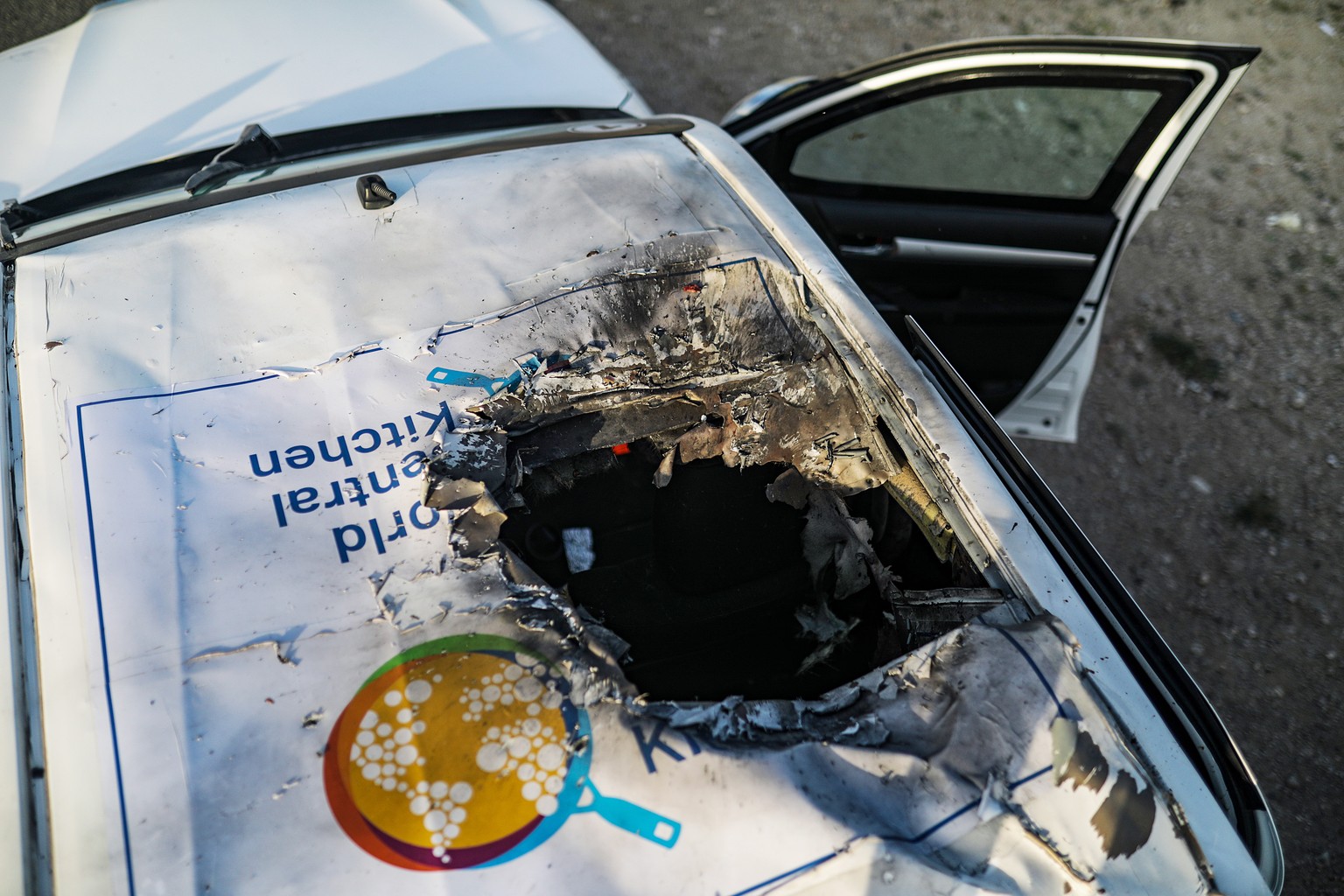 epaselect epa11255114 A destroyed car of the NGO World Central Kitchen (WCK) sits along Al Rashid road, between Deir Al Balah and Khan Younis in the southern Gaza Strip, 02 April 2024. NGO World Centr ...