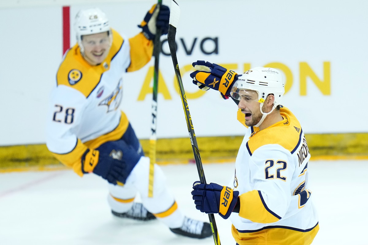 Nashville's Nino Niederreiter, right, celebrates with Nashville's Eeli Tolvanen after scoring his sides second goal during the NHL hockey game between San Jose Sharks and Nashville Predators ...