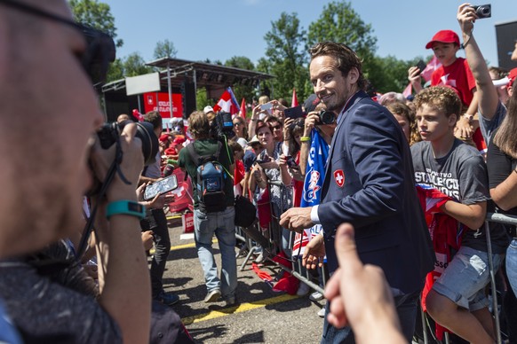 Switzerland’s ice hockey team with head coach Patrick Fischer arrives and is welcomed by fans at Zurich airport in Kloten, Switzerland, Monday, May 21, 2018. Switzerland won the silver medal at the II ...