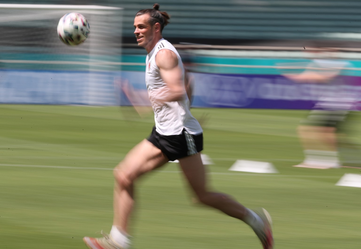 epa09261678 Gareth Bale of Wales warms up during a training session at Baku Olympic Stadium ahead of the UEFA EURO 2020 soccer tournament in Baku, Azerbaijan, 11 June 2021. Wales will face Switzerland ...