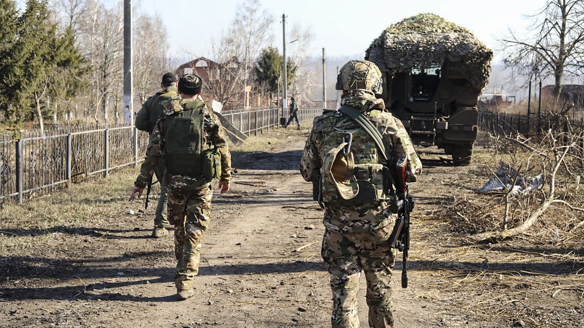 epa11964831 A handout photo made available by the Russian Defence Ministry's press-service shows Russian servicemen walking along at an area in the Kursk region, Russia, 14 March 2025. The Russia ...