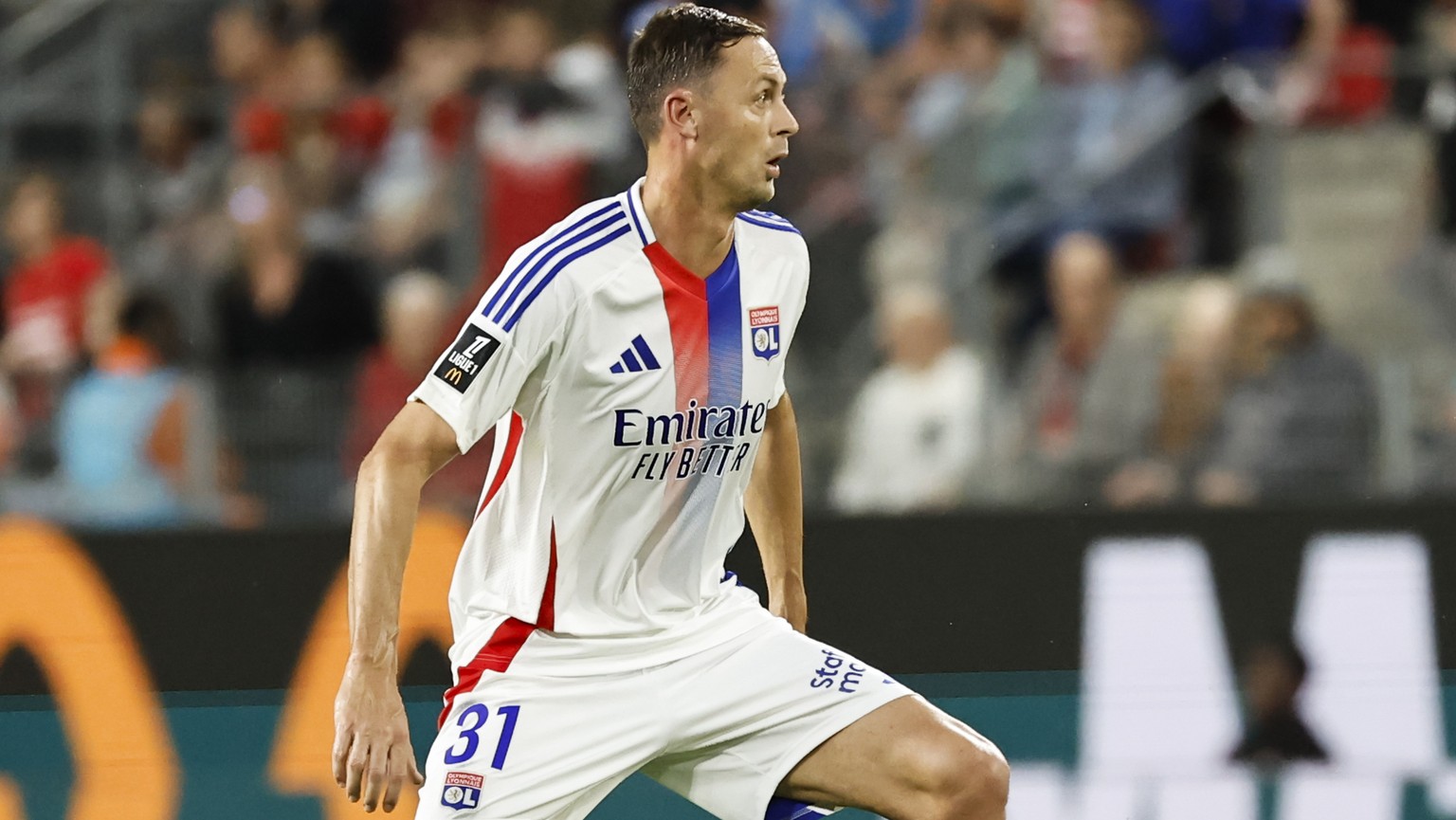 Lyon&#039;s Nemanja Matic dribbles the ball during the French League One soccer match between Rennes and Lyon at the Roazhon Park stadium in Rennes, France, Sunday, Aug. 18, 2024. (AP Photo/Jeremias G ...