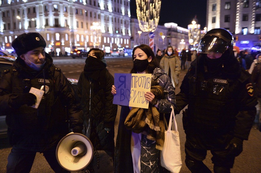 Police detain a demonstrator with a poster that reads &quot;I&#039;m against the war,&quot; in Moscow, Russia, on Thursday, Feb. 24, 2022, after Russia&#039;s attack on Ukraine. The Kremlin&#039;s cra ...