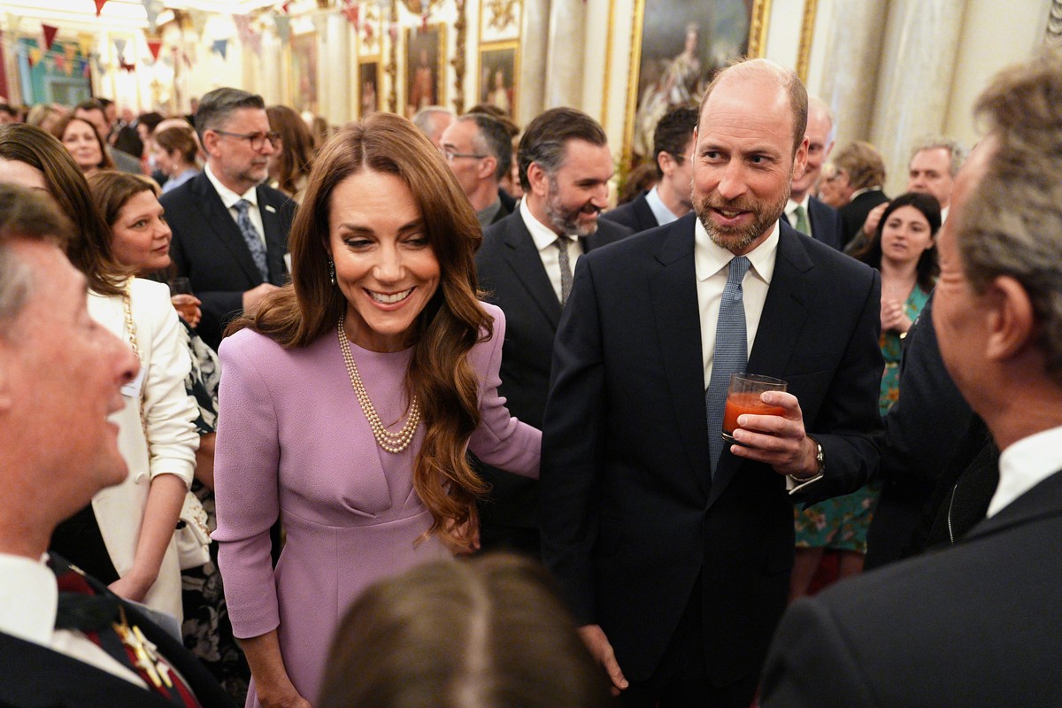 Britain's Prince William and Kate, Princess of Wales meet guests during a reception at Buckingham Palace, London, Tuesday, April 21, 2026, to celebrate the 100th anniversary of Queen Elizabeth II ...