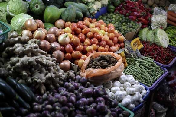 epa10412687 Vegetables displayed for sale at a market in Manila, Philippines, 17 January 2023 (issued on 18 January 2023). Soaring prices of fuel and food are exhausting the pockets of many Filipino h ...