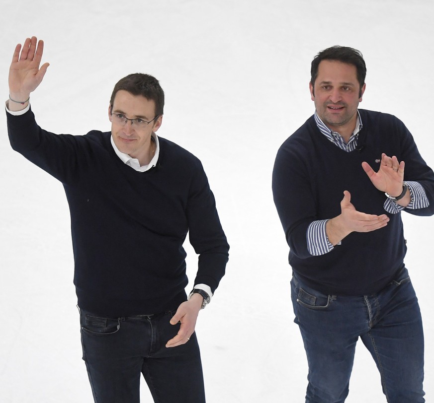 Ambri&#039;s Head Coach Luca Cereda, left, and Ambri&#039;s Sports Director Paolo Duca celebrate the pre-playoff qualification during the preliminary round game of National League Swiss Championship b ...