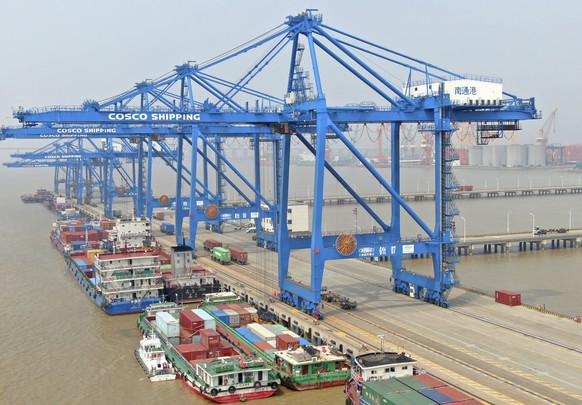 In this aerial photo, container ships are docked at a port on the Yangtze River in Nantong in eastern China&#039;s Jiangsu Province, Monday, Sept. 6, 2021. China&#039;s import and export growth accele ...