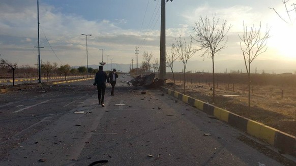 epa08846406 A handout photo made available by Iranian state TV (IRIB) official website shows the scene of terror attack on top Iranian nuclear scientist Mohsen Fakhrizadeh, in the city of Damavand, no ...