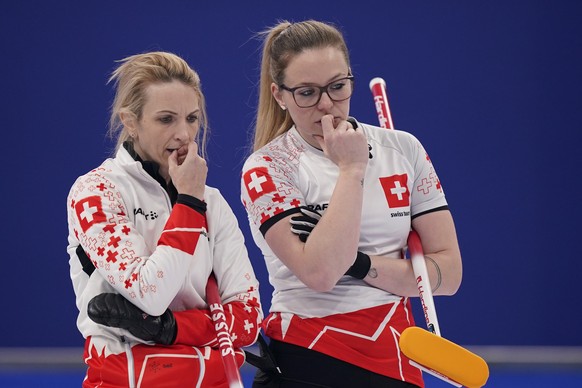 Switzerland&#039;s Silvana Tirinzoni, left, and Switzerland&#039;s Alina Paetz watch the women&#039;s curling bronze medal match between Sweden and Switzerland at the Beijing Winter Olympics Saturday, ...