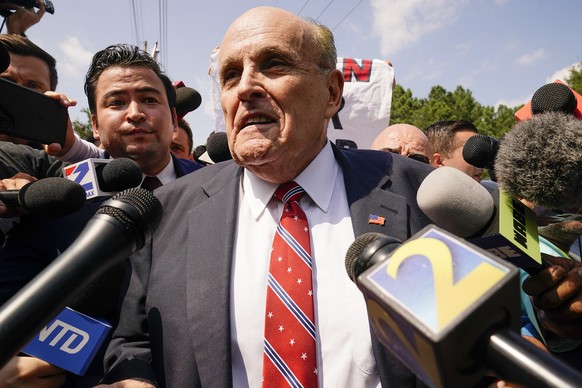 Rudy Giuliani speaks outside the Fulton County jail, Wednesday, Aug. 23, 2023, in Atlanta. Giuliani has surrendered to authorities in Georgia to face an indictment alleging he acted as former Presiden ...