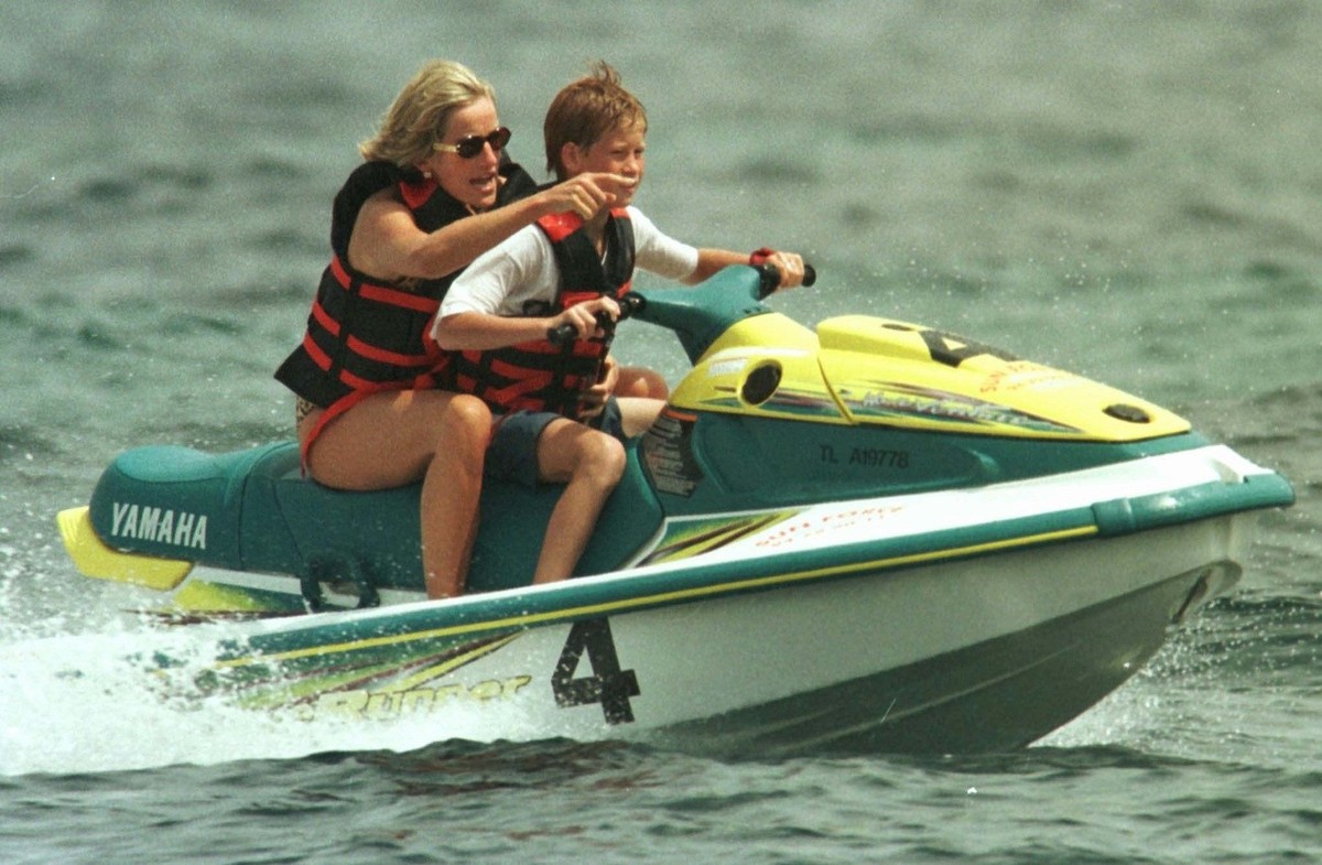 Britain's Diana, Princess of Wales, practices jet-ski with her son Prince Harry , steering Thursday July 17, 1997 in Saint Tropez, French Riviera, where she spends a few days holidaying. (KEYSTON ...