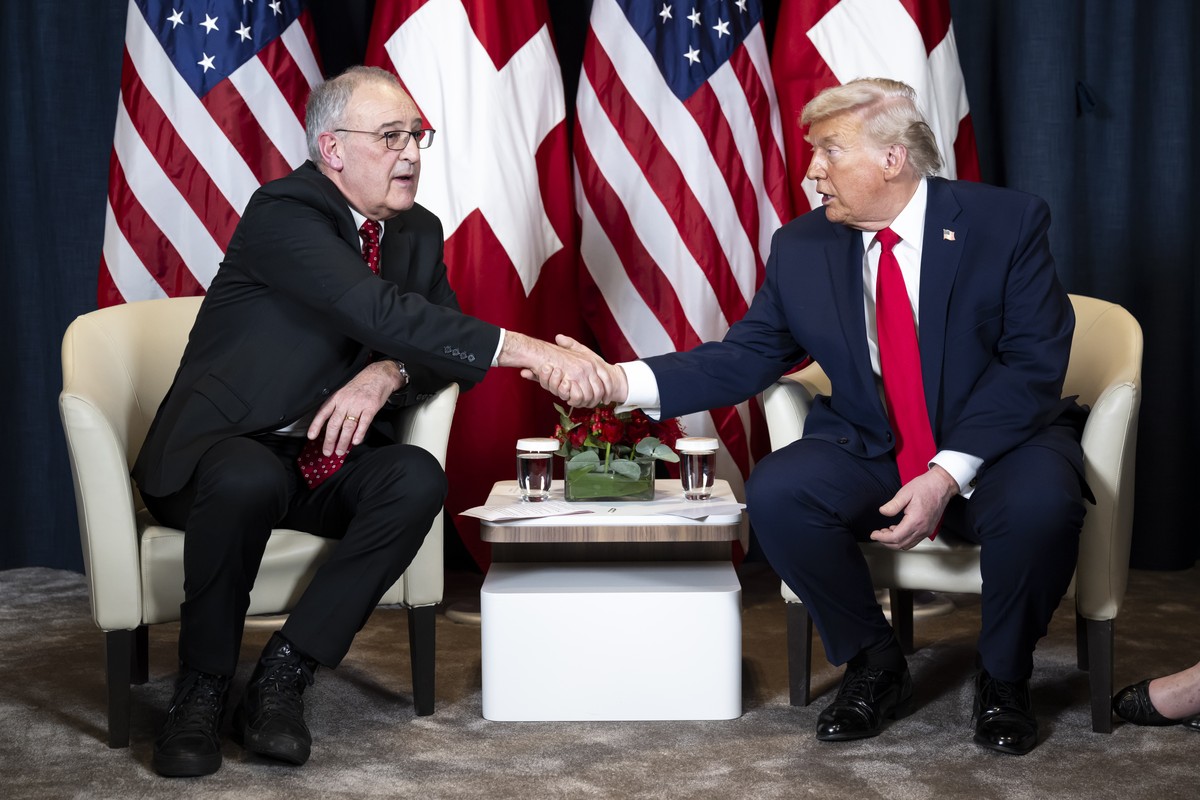 epa12667951 Switzerland's Federal President Guy Parmelin (L) and US President Donald Trump (R) shake hands prior to a bilateral meeting in Congress Centre on the sidelines of the 56th annual meet ...