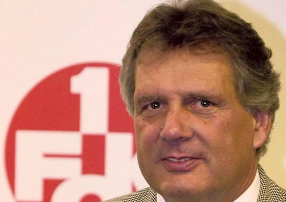 Swiss manager Rene C. Jaeggi poses close to the logo of 1. FC Kaiserslautern Wednesday, Sept. 4, 2002, in the Kaiserslautern, Germany, soccer stadium. Jaeggi will become general manager of the club. ( ...