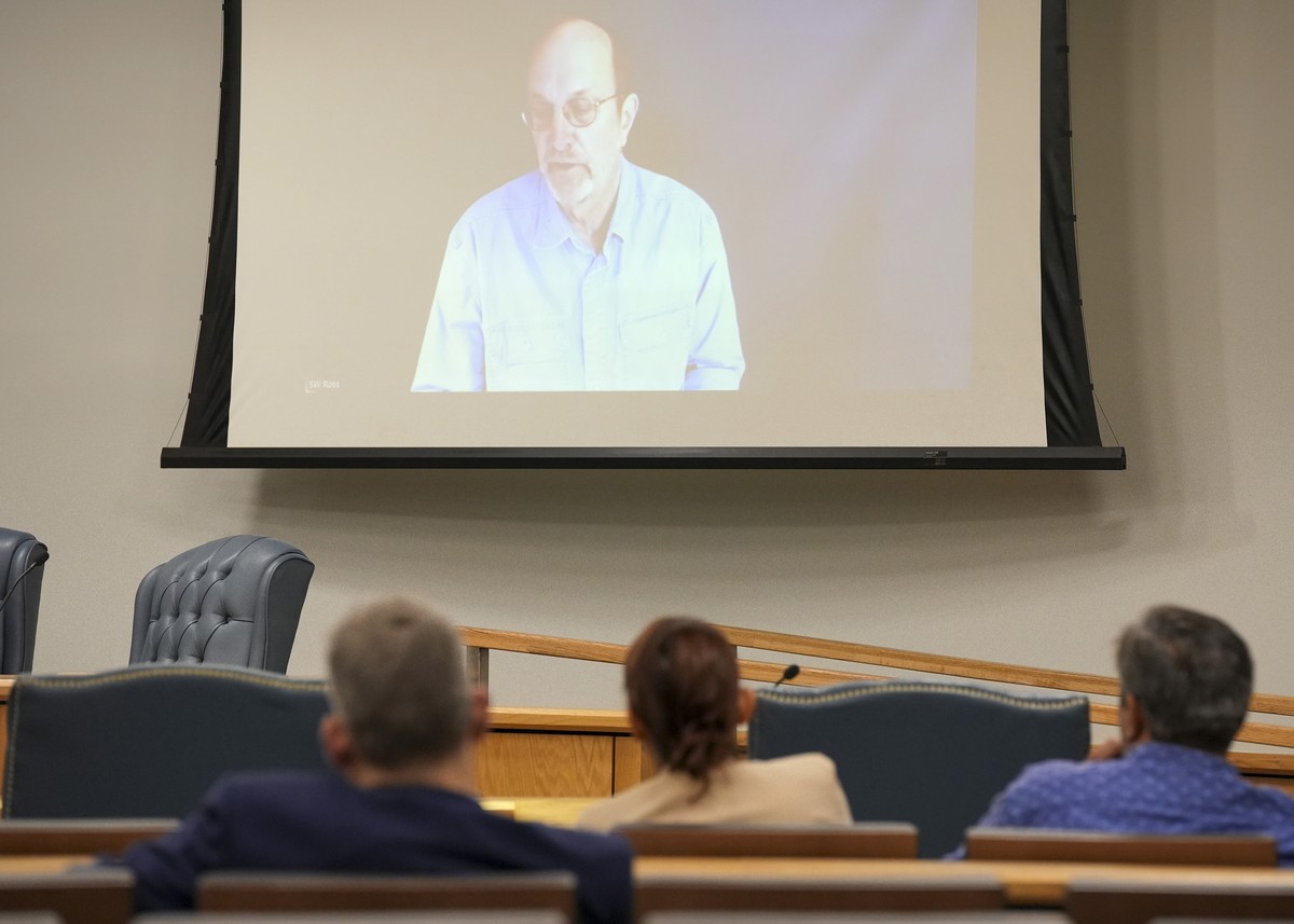 Steven Ross, former OceanGate scientific director, top, speaks via video link as he testifies during the Titan marine board formal hearing inside the Charleston County Council Chambers, Thursday, Sept ...