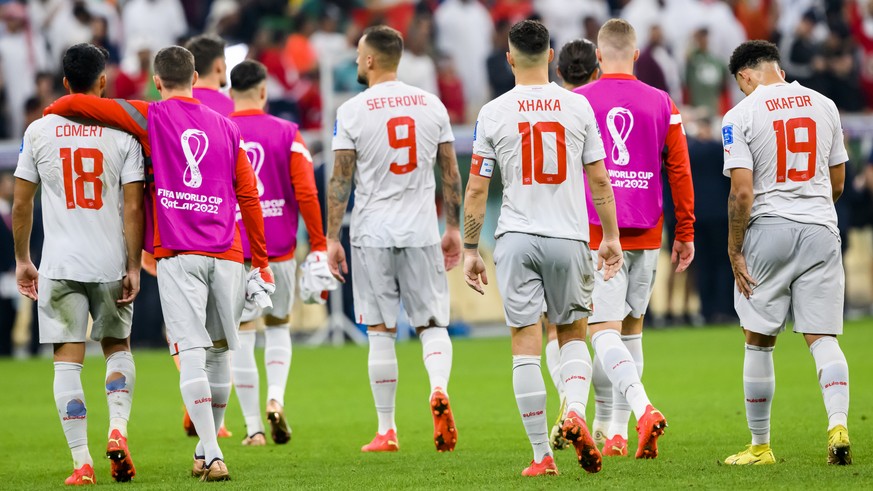 Switzerland's soccer players react after the elimination during the FIFA World Cup Qatar 2022 round of 16 soccer match between Portugal and Switzerland at the Lusail Stadium in Lusail, north of D ...